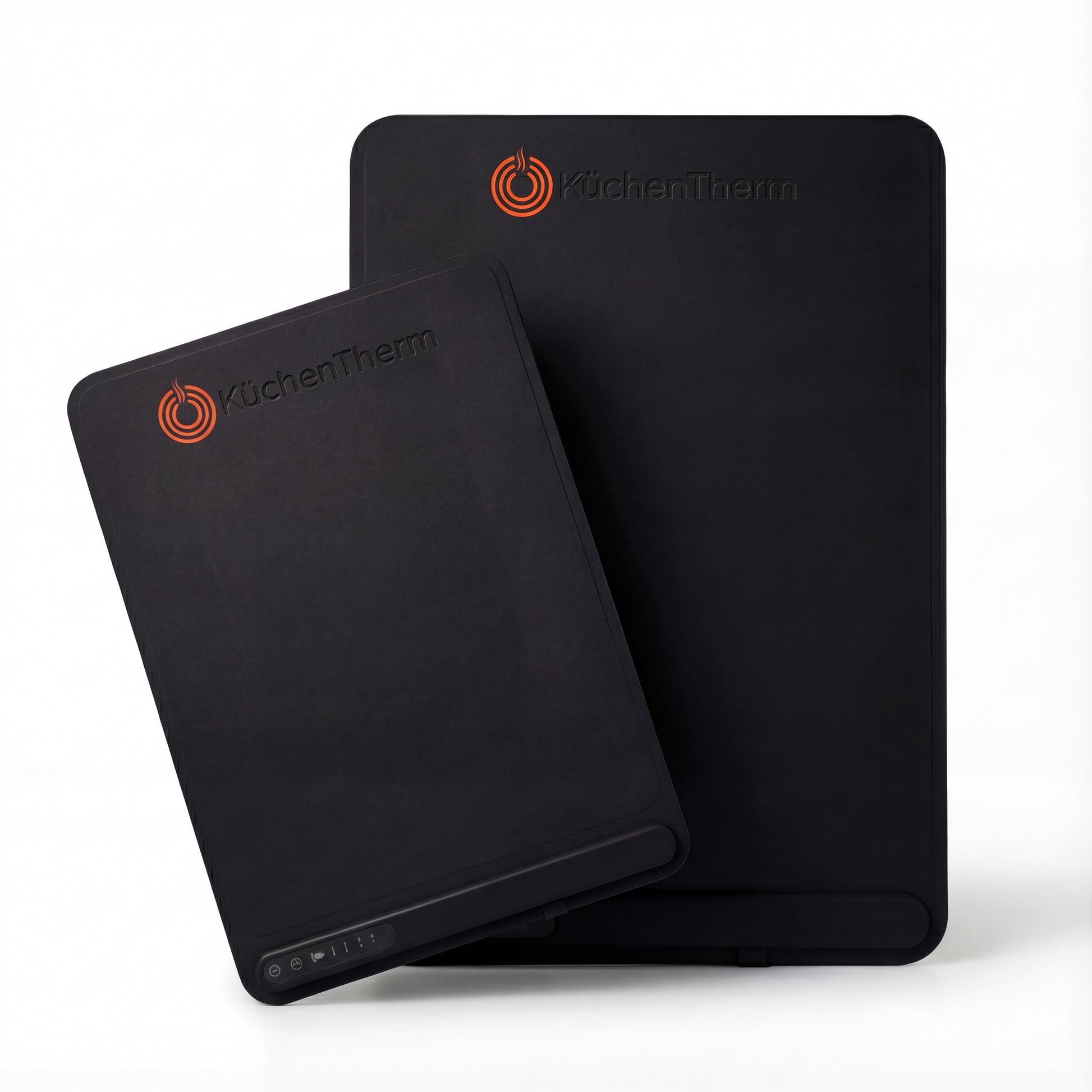 Two black silicone mats with 'KuchenTherm' branding on a white background