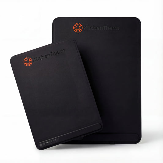 Two black silicone mats with 'KuchenTherm' branding on a white background